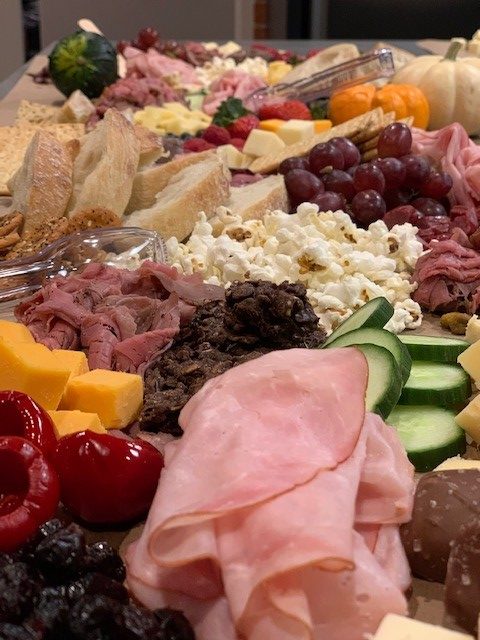 Delicious Grazing Table featuring Gillum Family Farms Deli and Assortment of Cheeses, Fruits and Veggies